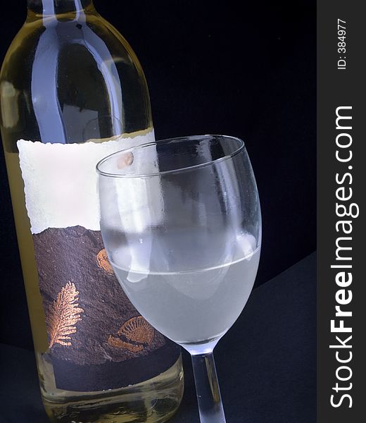 Wine bottle and coldfrosted glass. Wine bottle and coldfrosted glass