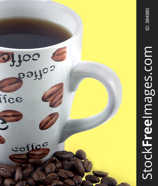 Isolated over yellow coffee and coffee beans. Isolated over yellow coffee and coffee beans