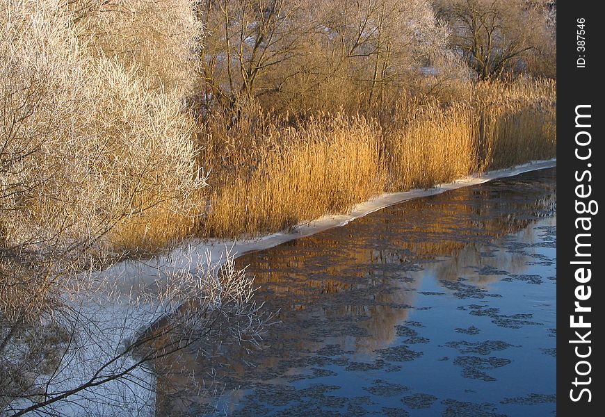 Coast of the small river during a strong frost. Coast of the small river during a strong frost