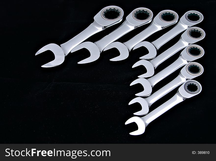 Tradesmans combination spanners isolated on black.