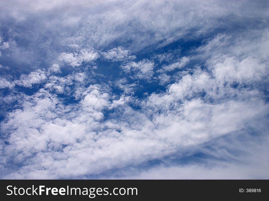 Wispy clouds against a deep polarized sky. Wispy clouds against a deep polarized sky.