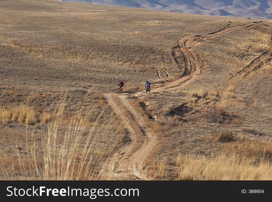 Bikers in desert road, in autumn