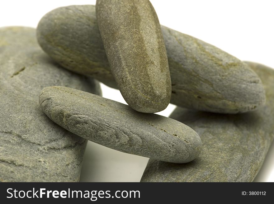 Grey pebbles on white background