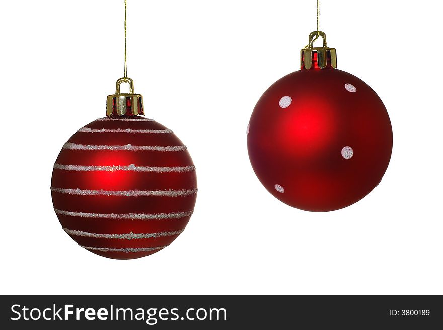 Two hanging Christmas baubles isolated on a white background. Two hanging Christmas baubles isolated on a white background