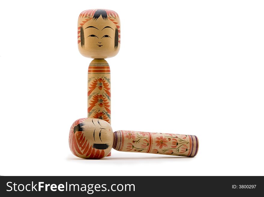 Japanese Kokeshi dolls photograph on white background. Japanese Kokeshi dolls photograph on white background