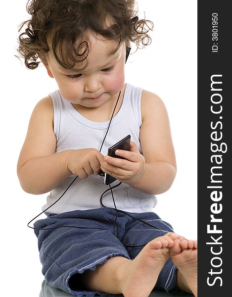 Child with mp 3 player,isolated on a white background. Child with mp 3 player,isolated on a white background.