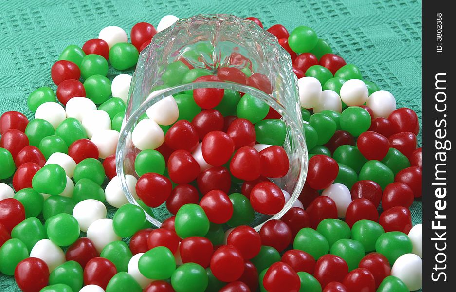 Colorful Christmas candy spill from a glass.