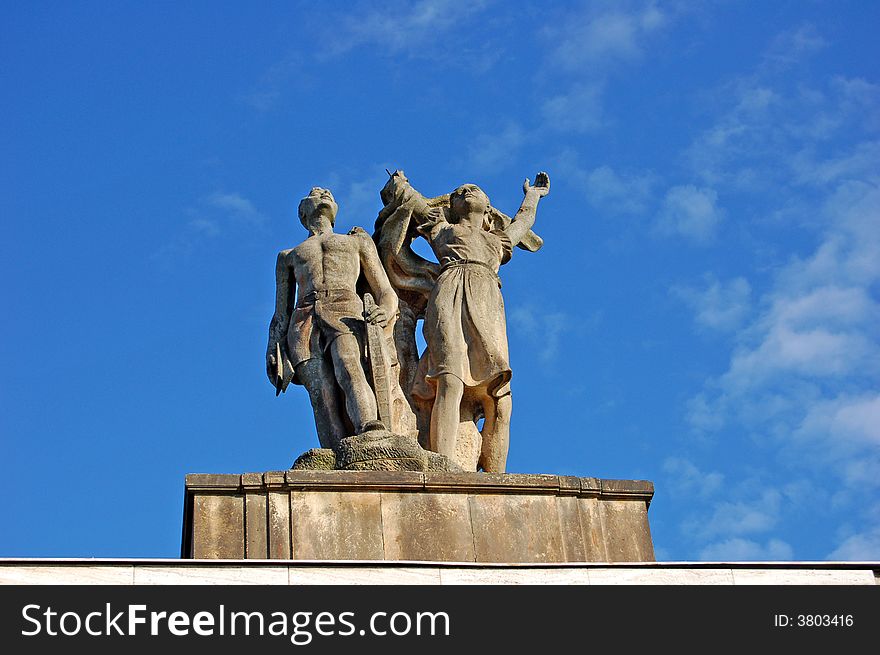 A statue of a young men and women