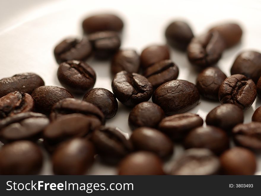A close up image of coffee beans. A close up image of coffee beans