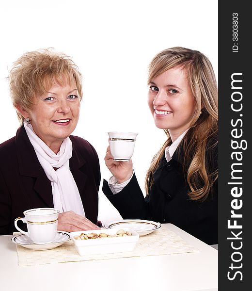 Mother and daughter drinking coffee together