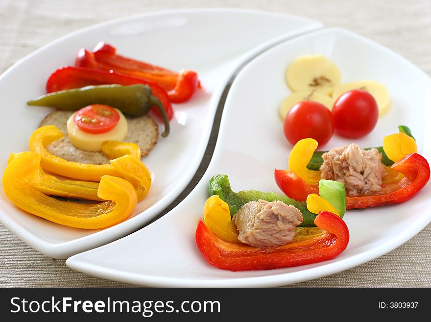 Healthy colorful platter with assorted vegetables on fancy white china. Healthy colorful platter with assorted vegetables on fancy white china