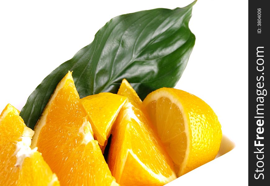 Juicy oranges, lemon and green leaf. Juicy oranges, lemon and green leaf