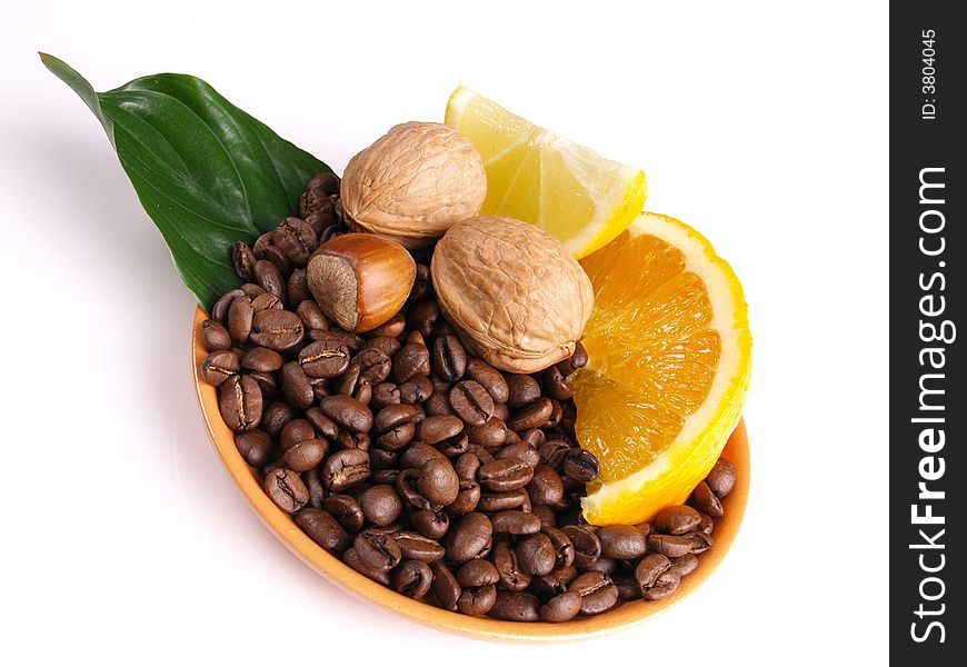 Coffee beans, juicy oranges, walnut and lemon. Coffee beans, juicy oranges, walnut and lemon