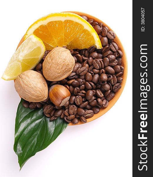 Coffee beans, juicy oranges,  nut and lemon. Coffee beans, juicy oranges,  nut and lemon