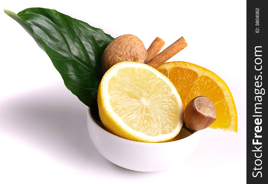 Juicy oranges, cinnamon, nut, lemon and green leaf. Juicy oranges, cinnamon, nut, lemon and green leaf