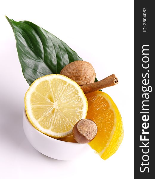 Lemon, oranges, cinnamon, nut and green leaf. Lemon, oranges, cinnamon, nut and green leaf