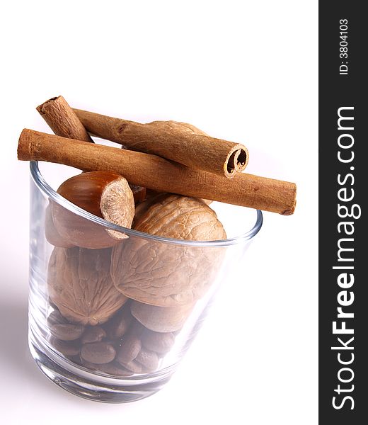 Cinnamon, walnut and nut in the white background. Cinnamon, walnut and nut in the white background