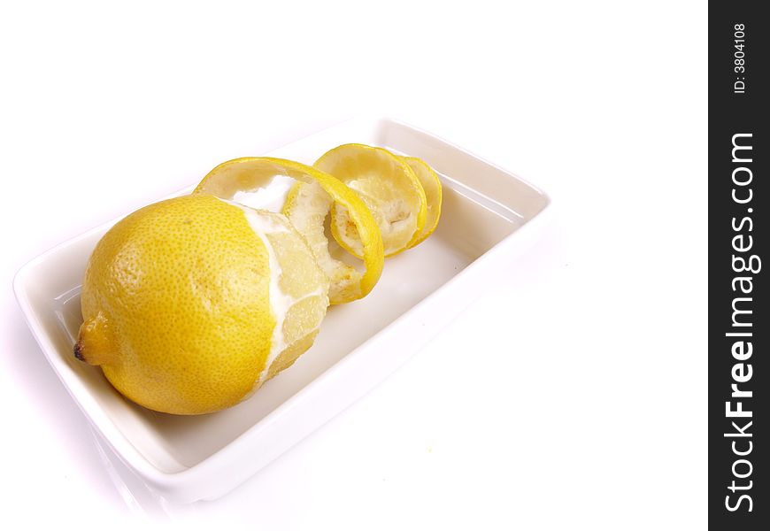 Juicy lemon in the white bowl