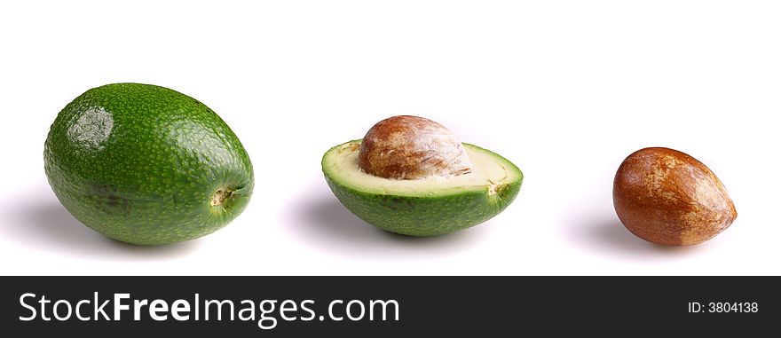 Whole and half avocados isolated on white background. Whole and half avocados isolated on white background