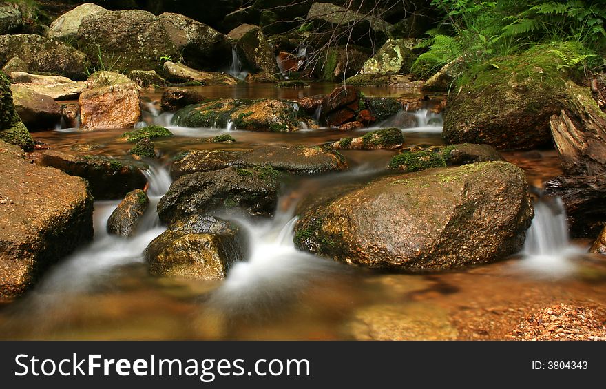 Autumn on stream in czech mountains