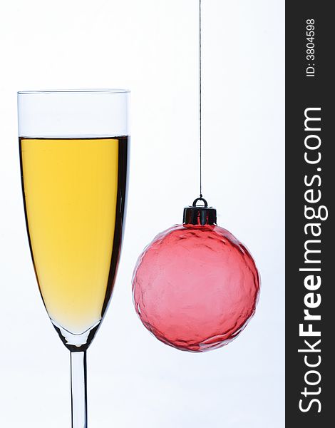 Christmas ornament and glass with champagne. Christmas ornament and glass with champagne