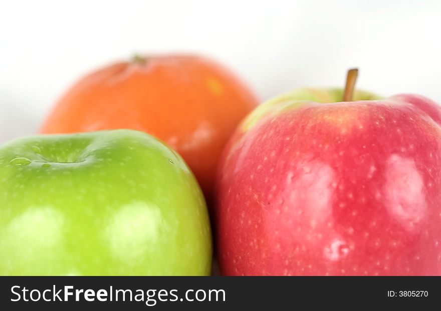 Orange and apples isolated on white background