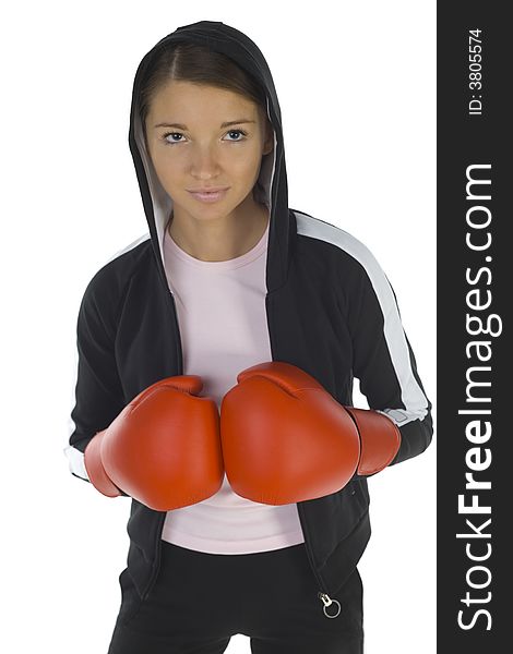 Young, hooded beauty with boxing gloves. Smiling and looking at something. White background, front view. Young, hooded beauty with boxing gloves. Smiling and looking at something. White background, front view