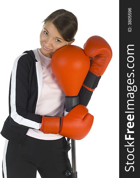 Young beauty with boxing gloves. Hugging punch bag. Smiling and looking at camera. White background, front view. Young beauty with boxing gloves. Hugging punch bag. Smiling and looking at camera. White background, front view