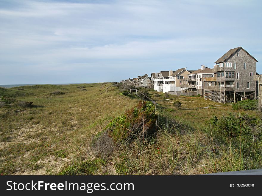 Houses at the ocean by sand dunes for vacation