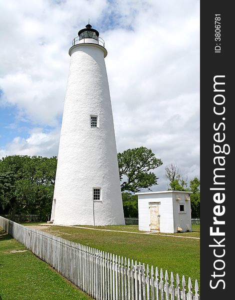 Ocracoke Island Lighthouse with small white building