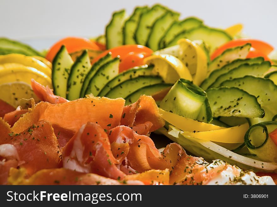 Closeup of cold meat and fresh vegetables