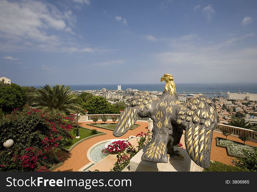 View of Haifa from Baha'i Gardens with ornamental eagle in foreground