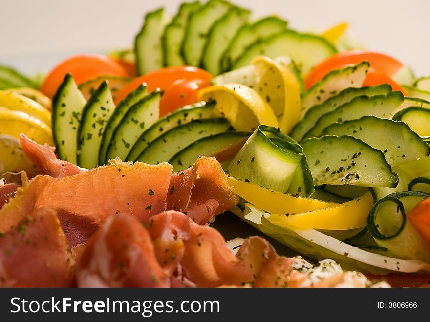 Closeup of cold meat and fresh vegetables