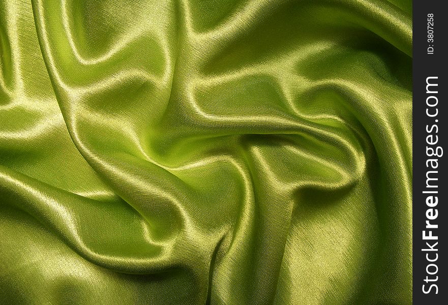 Wrinkled green satin as background