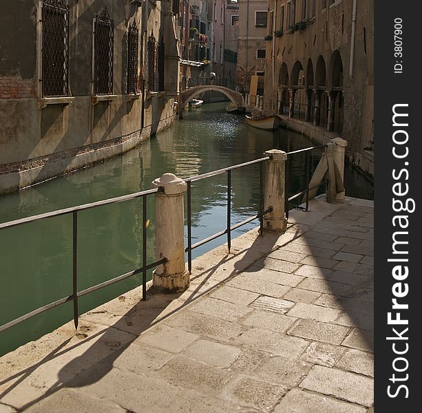 Canal and bridge in back street shot in Venice. Canal and bridge in back street shot in Venice