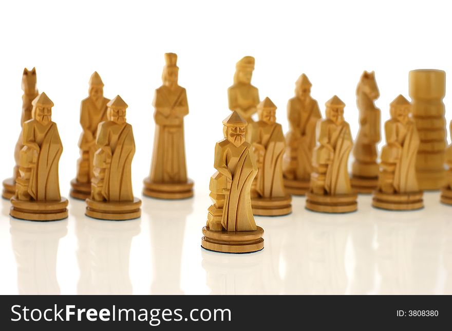 Course a pawn. Chessmen cut out from a tree - handicraft