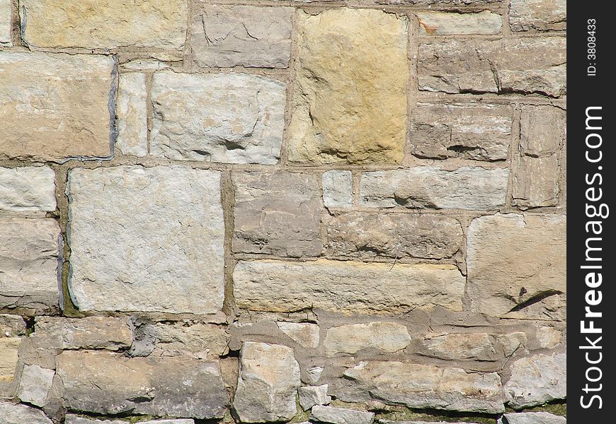 Light neutral colored old stone wall background