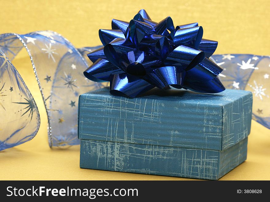 Blue gift box and silver celebration ribbon