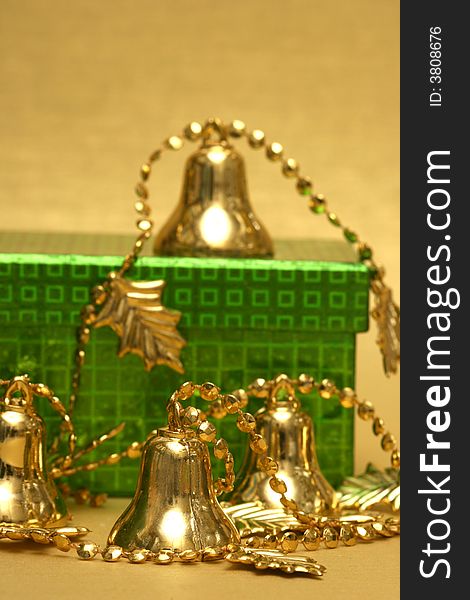 Golden Christmas handbell and gift box