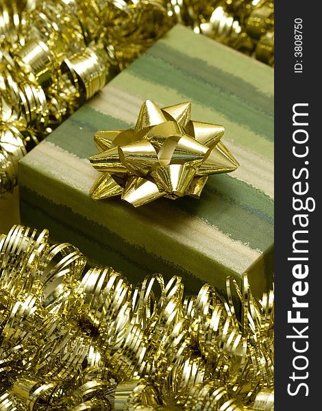 Green gift box and golden garland