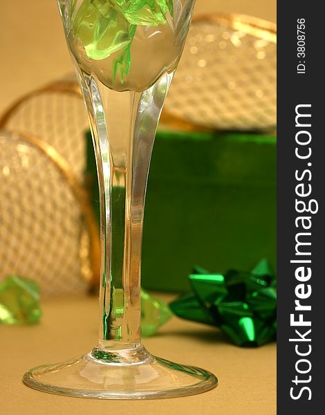 Celebration table green gift box and glass