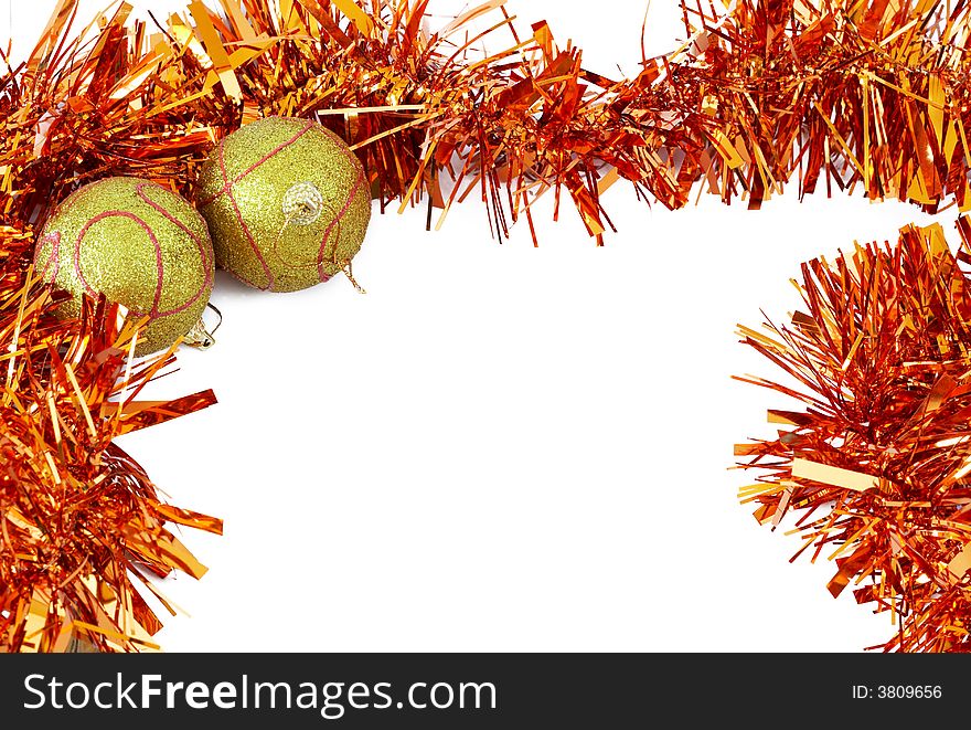 Two yellow Christmas baubles with bright orange tinsel forming a frame on white backgound. Two yellow Christmas baubles with bright orange tinsel forming a frame on white backgound