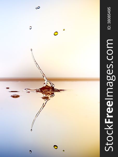 Splashing water drops on color background