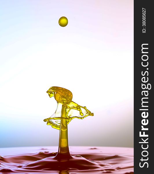 Splashing water drops on color background