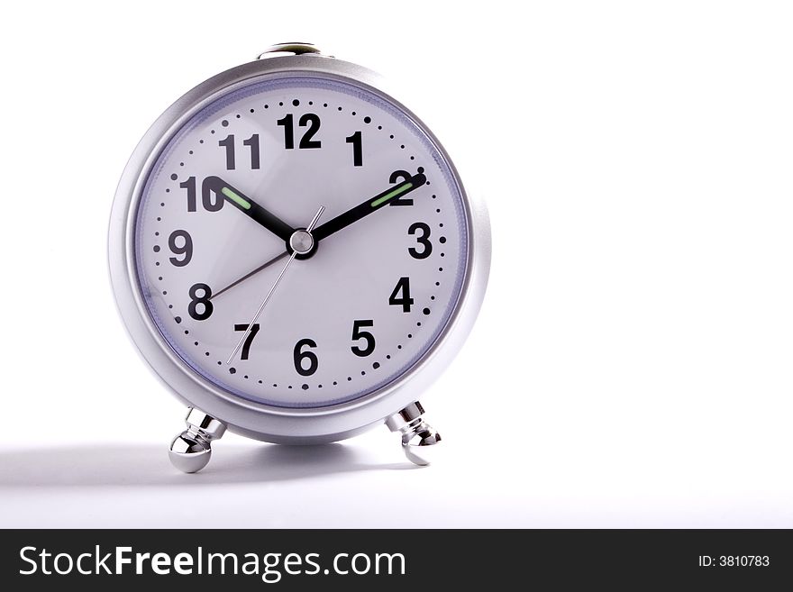 Classic alarm clock on white background