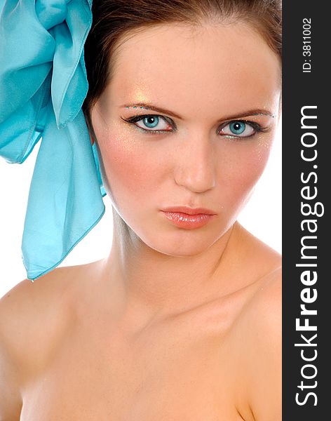 Close-up portrait of a girl with big blue bow in hair on the white background. Close-up portrait of a girl with big blue bow in hair on the white background