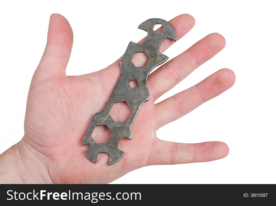 Hand of man holding wrench isolated on white
