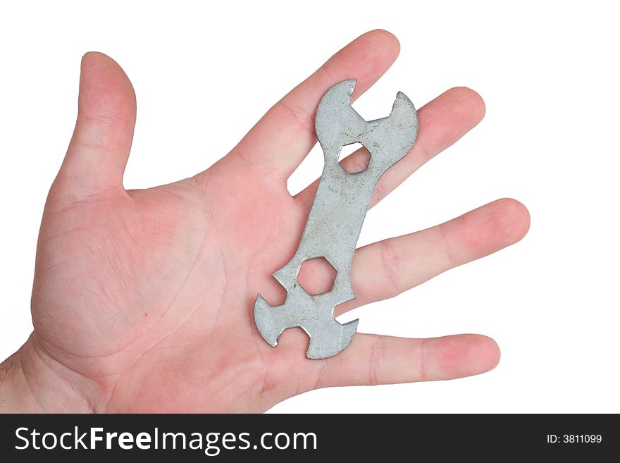 Hand of man holding wrench isolated on white