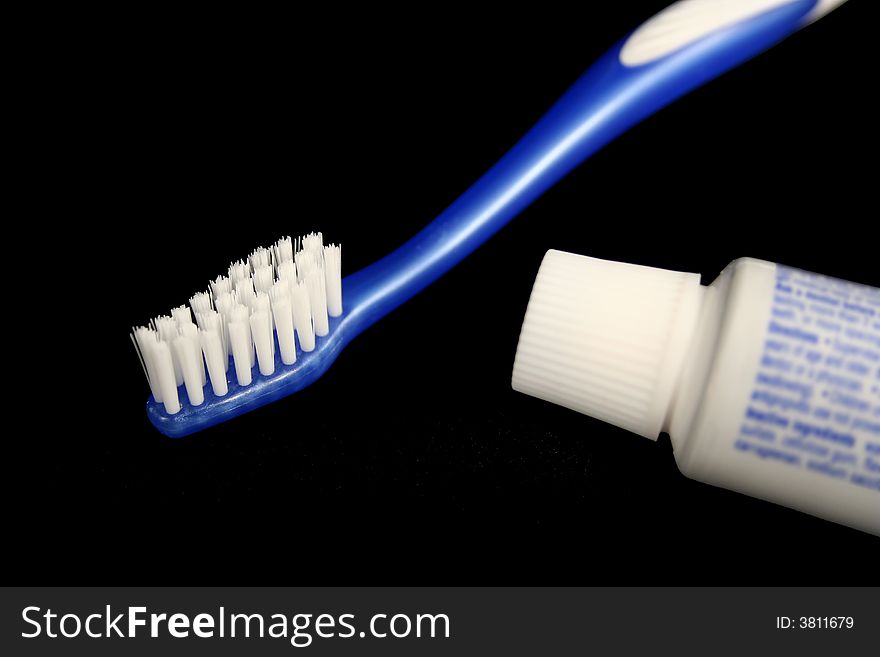 Blue toothbrush and toothpaste