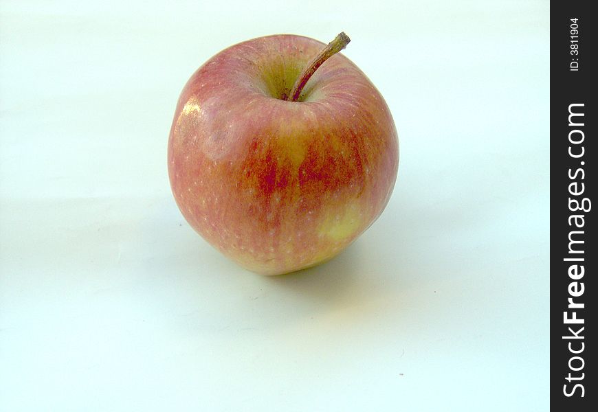 Red apple on light background